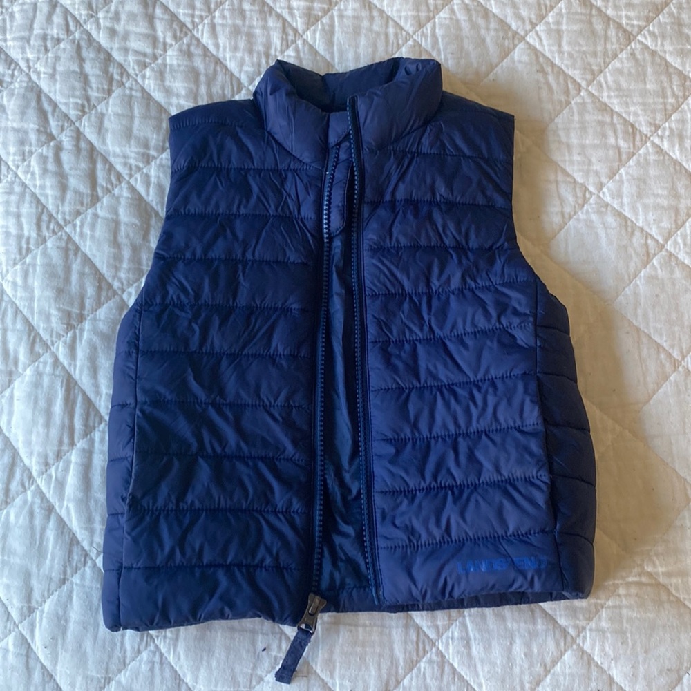 Lands End navy blue down zip up vest.  Like new!